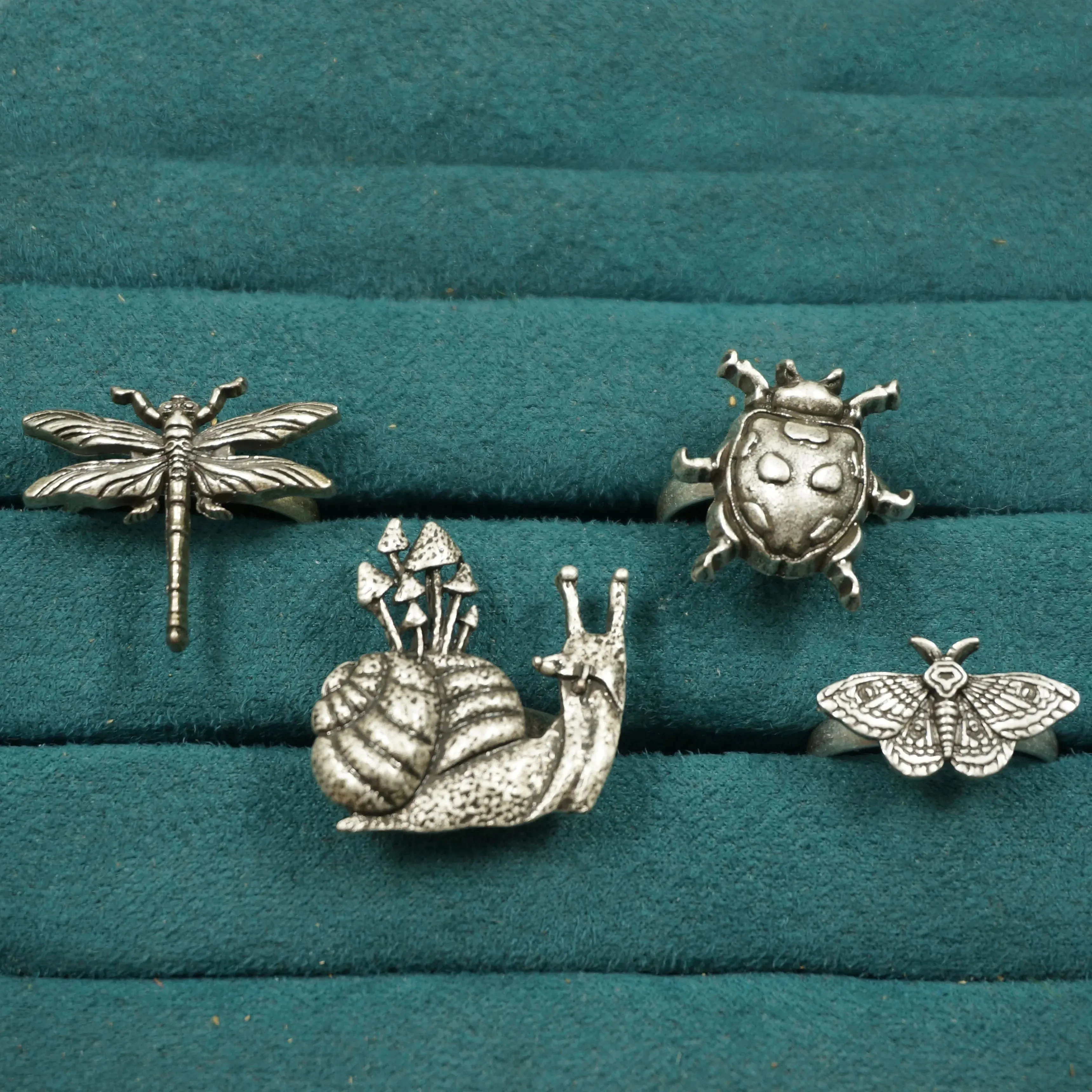 A set of 4 Cute Critter Rings Dragonfly Mushroom Snail Ladybug Moth Rings