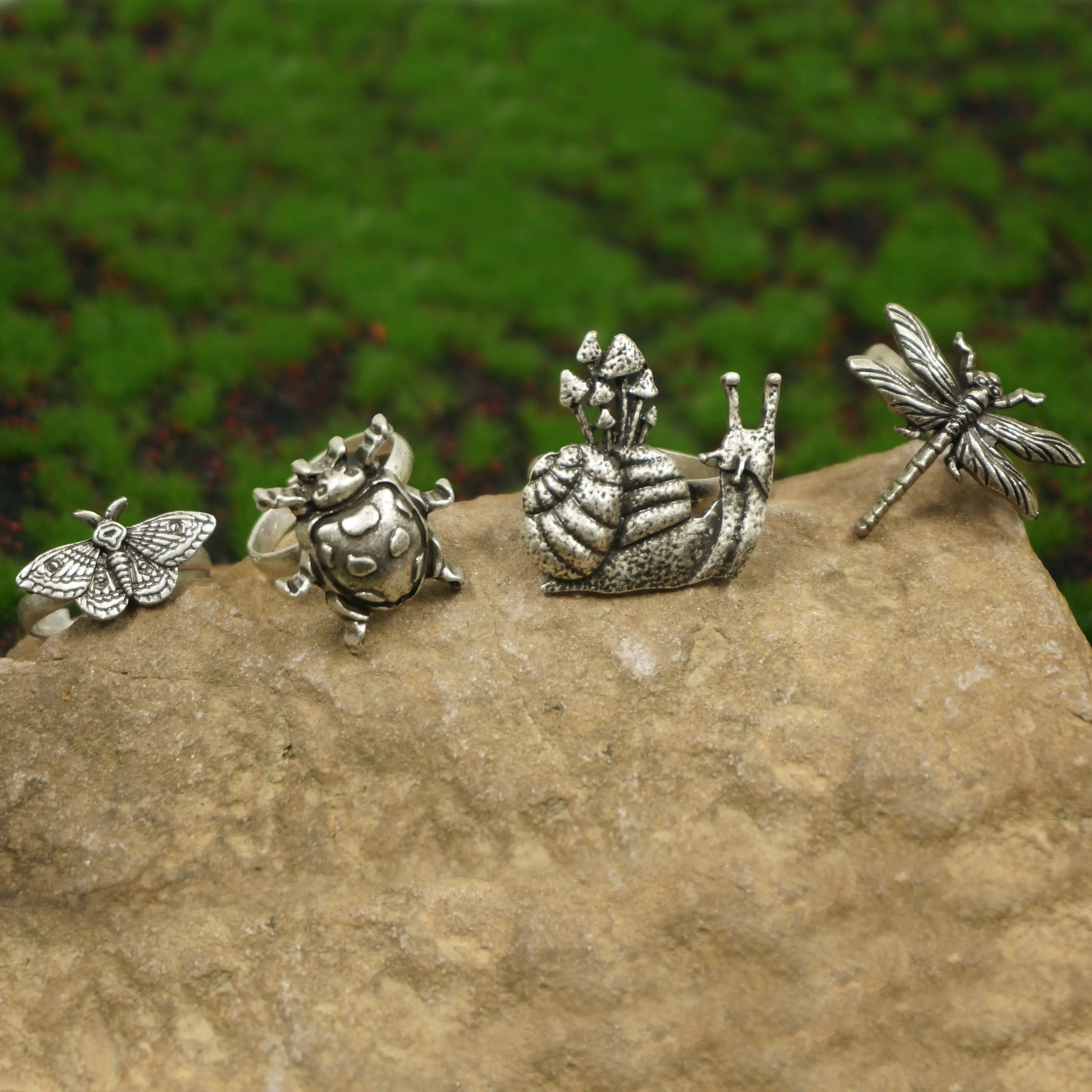 A set of 4 Cute Critter Rings Dragonfly Mushroom Snail Ladybug Moth Rings