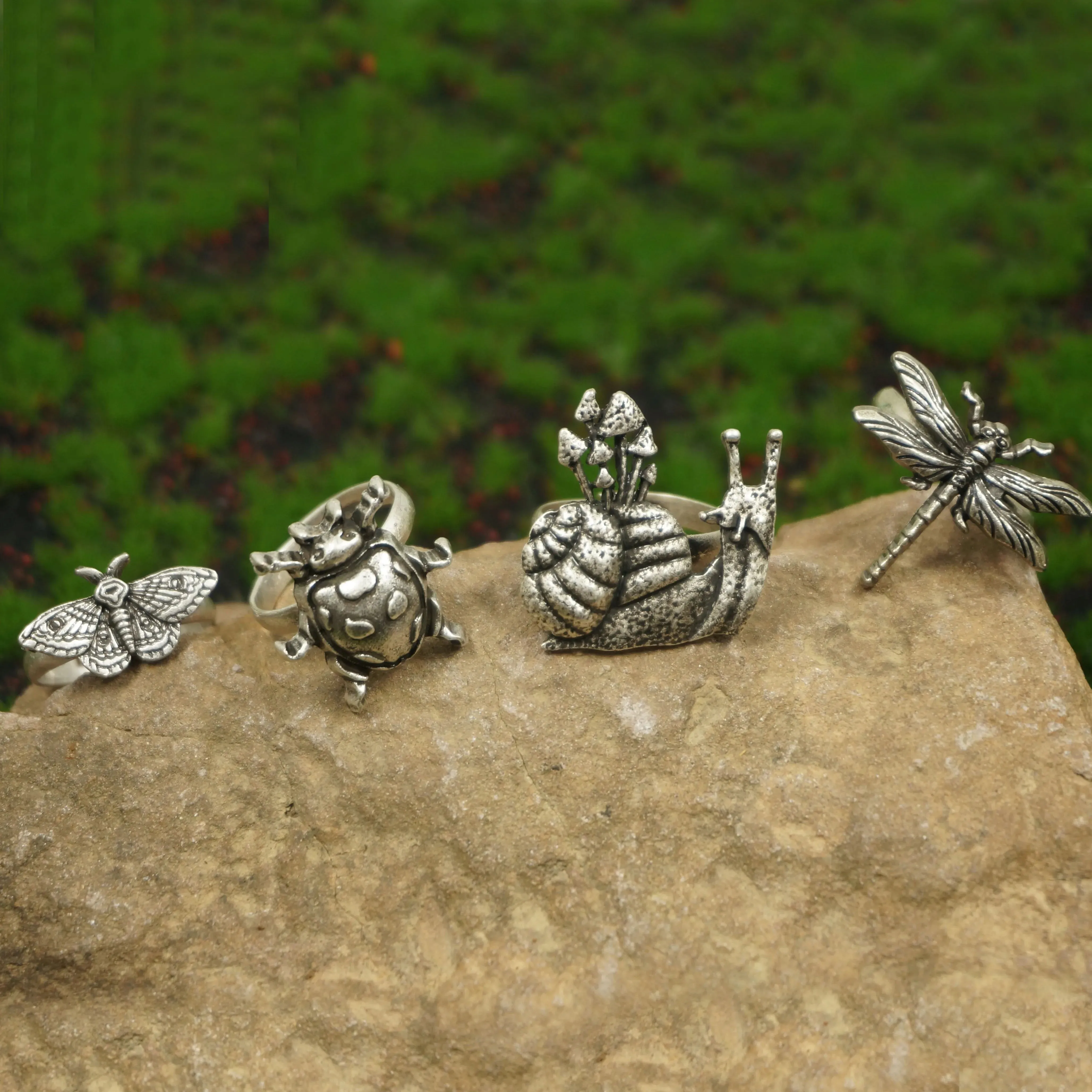 A set of 4 Cute Critter Rings Dragonfly Mushroom Snail Ladybug Moth Rings