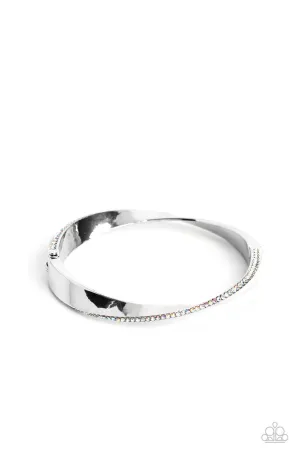 Artistically Adorned - Multi - Warped Iridescent Rhinestone Encrusted Silver Paparazzi Hinge Bracelet